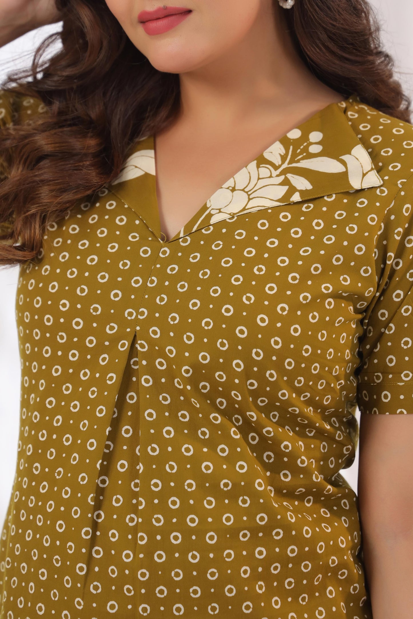 Close-up of amber dot print texture on 100% cotton fabric – Noor Aura Amber Dot Top by Karpaa