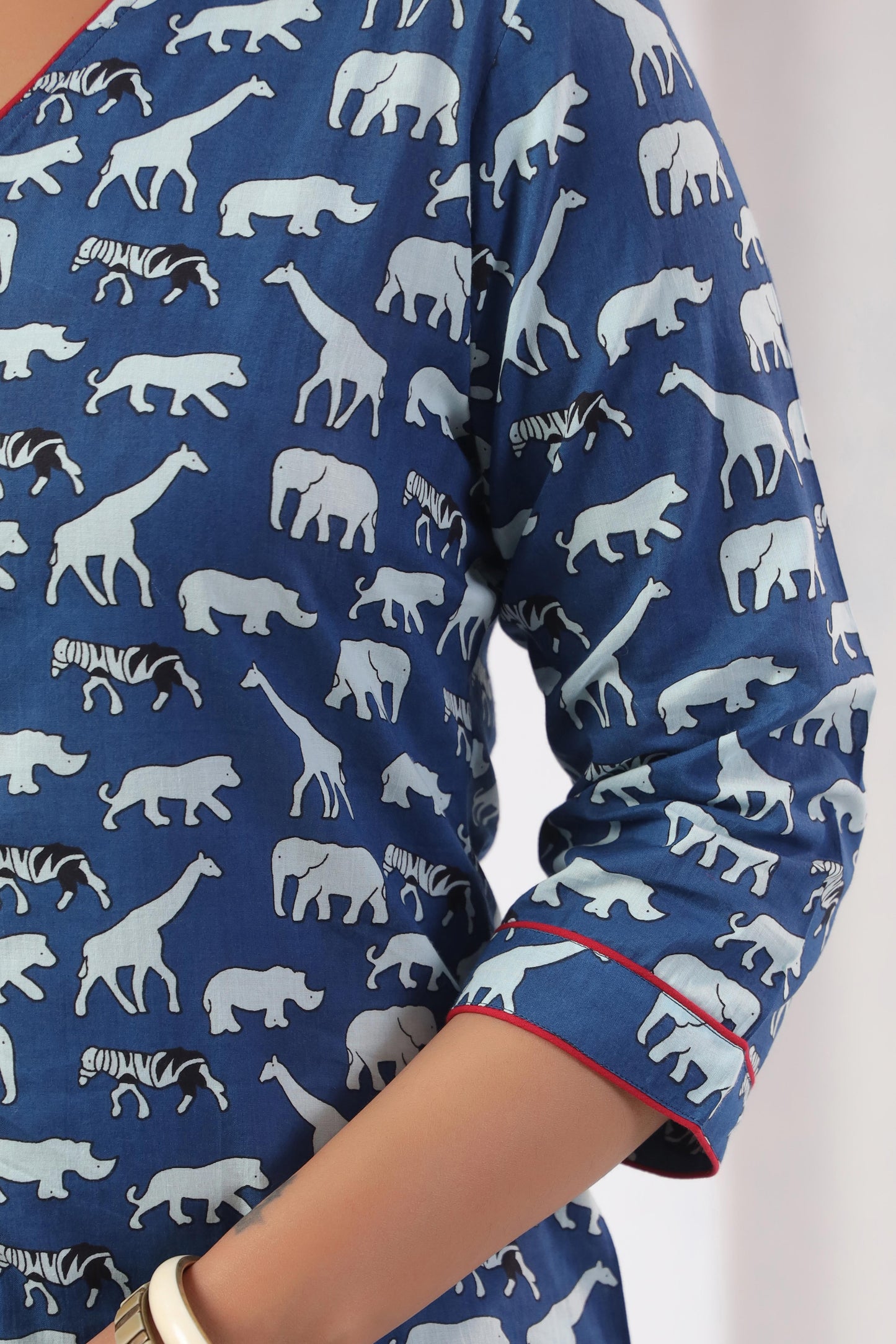 Close-up of bold safari animal trail all-over print on Noor Aura 100% cotton co-ord set fabric - Karpaa